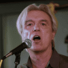 Watch David Byrne performing Bowie’s “Heroes” with choir