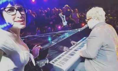 Watch Elton John being hit by a necklace during a show