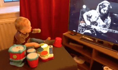 Kid plays the drums while sees Dave Grohl