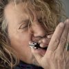 Robert Plant playing harmonica