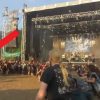 Woman takes baby Into a Wall of Death at Metal Concert