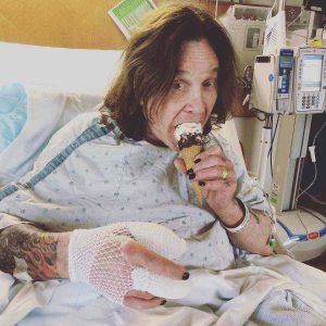 Ozzy Osbourne taking ice cream in the hospital