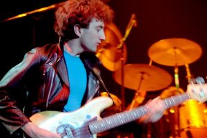 John Deacon playing bass