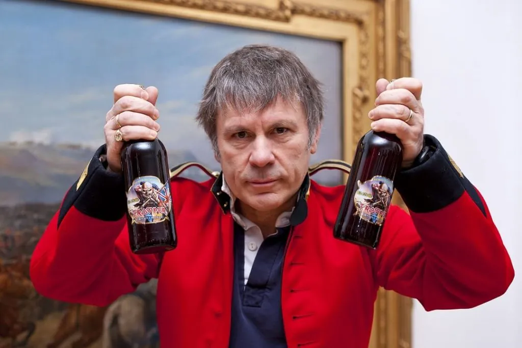 Bruce Dickinson holding beer
