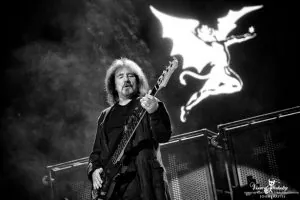 Geezer Butler playing bass
