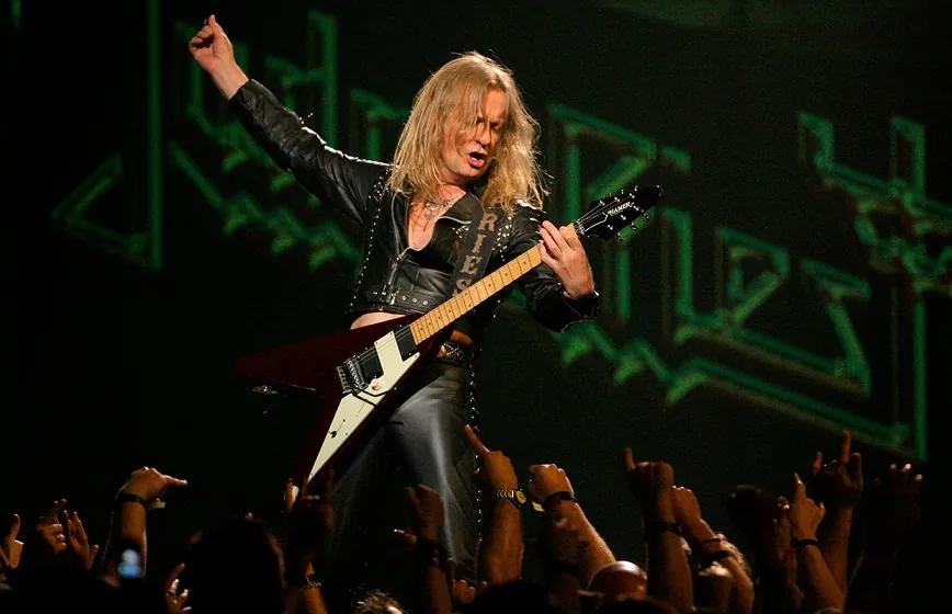 KK Downingplaying guitar