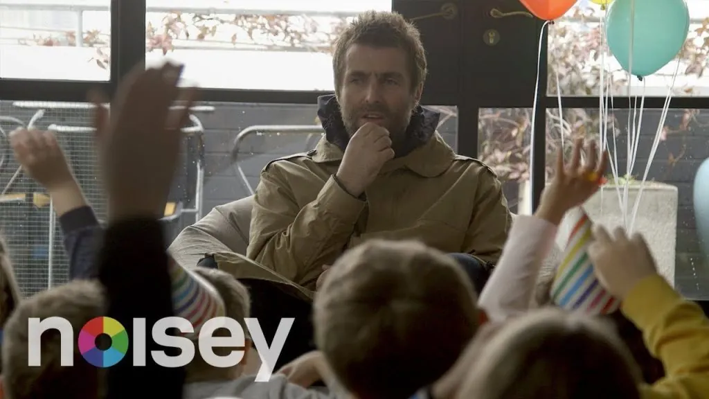Liam Gallagher being interviewed by kids