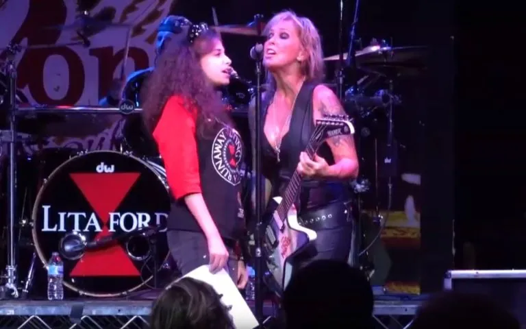 Lita Ford and young fan
